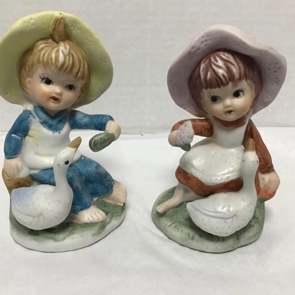 Vintage boy and girl with ducks figurine size around 3 inches.